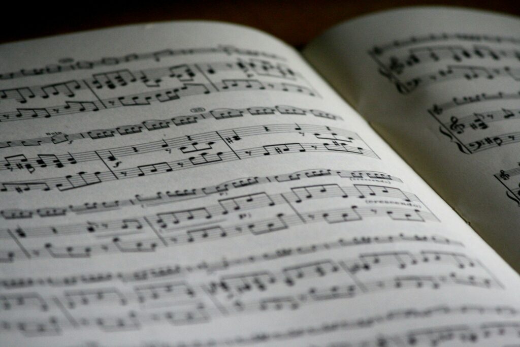 pexels-photo-164821-164821 Detailed close-up of a music sheet showing complex musical notes and compositions.